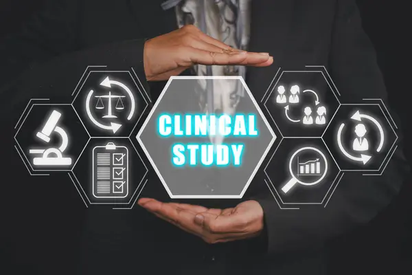 Clinical study concept, Business woman hand holding clinical study icon on virtual screen.