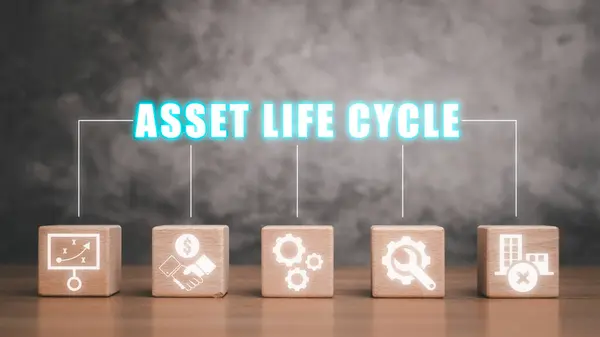 Asset life cycle concept, Wooden block on desk with asse life cycle icon on virtual screen.