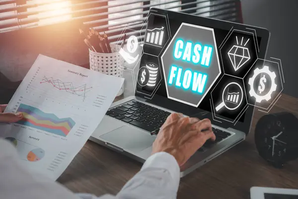 Cash flow concept, Businessman working on laptop computer with cash flow icon on virtual screen.