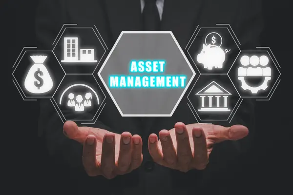 Asset management concept, Businessman hand holding asset management icon on virtual screen.
