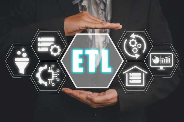 ETL, extract transform load concept, Businesswoman hand holding extract transform load icon on virtual screen.