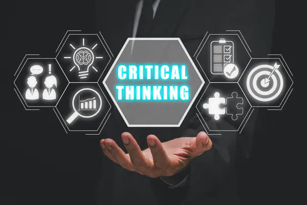 Critical thinking concept, Businessman hand holding critical thinking icon on virtual screen, New ideas and innovations arise and search for answers.