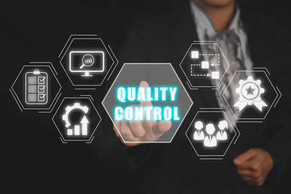 Quality control concept, Business person hand touching quality control icon on virtual screen.
