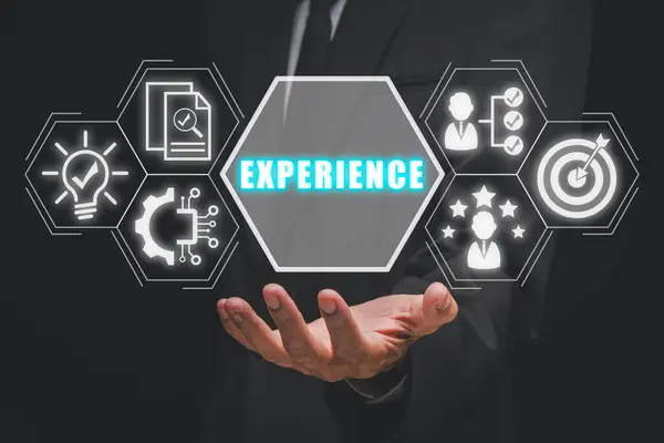 Experience concept, Business person hand holding experience icon on virtual screen.