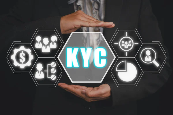 KYC, Know Your Customer concept, Business person hand holding Know Your Customer icon on virtual screen.