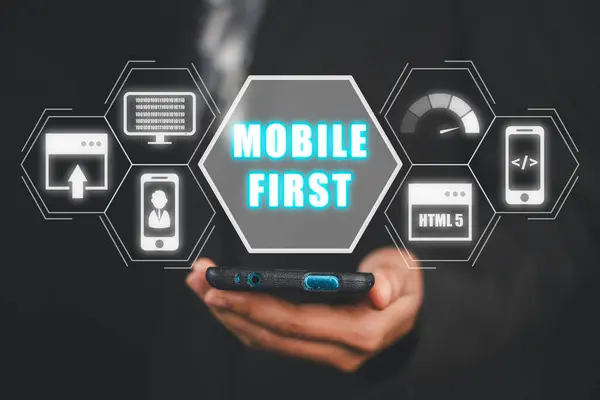 Mobile first concept, Business woman using mobile phone with mobile first icon on virtual screen, webdesign, programming, user-friendly, performance.