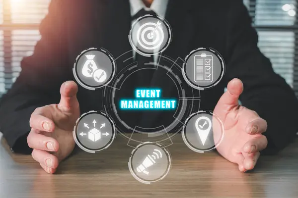 Event management concept, Businessman hand holding event management icon on virtual screen, scheduling, creativity, budget, location, coordinating, marketing, logistics.
