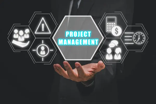Project management concept, Businessman hand holding project management icon on virtual screen, cost, time, scope, human resources, risks, quality and communication.
