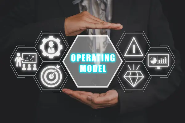 Operating model concept, Business woman hand holding operating icon on virtual screen. Technology, Performance, Strategy, Decision Making, Business Model, Understanding, Management, Representation.