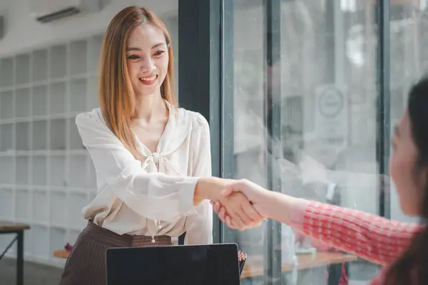 Business woman offer and give hand for handshake in office. Successful job interview. Apply for loan in bank.