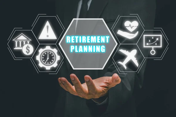 Retirement planning concept, Businessman hand holding retirement planning icon on virtual screen.