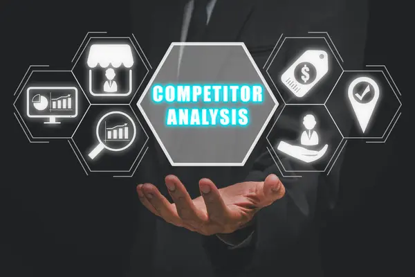 Competitor analysis concept, Businessman hand holing competitor analysis icon on virtual screen.
