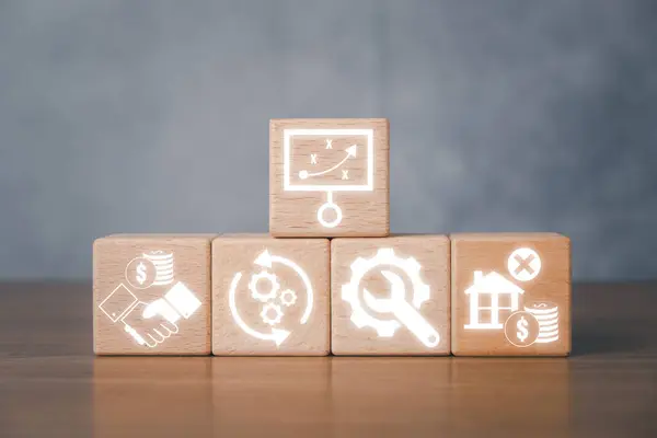 Asset life cycle concept, Wooden block on desk with asset life cycle icon on virtual screen.