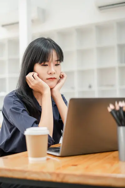 Young Businesswoman Braces Looks Her Laptop Screen Possibly Problem Solving Stock Photo