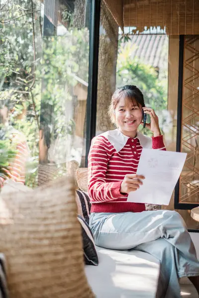 Bright Cheerful Businesswoman Enjoying Pleasant Conversation Phone Holding Report Sunlit Stock Picture