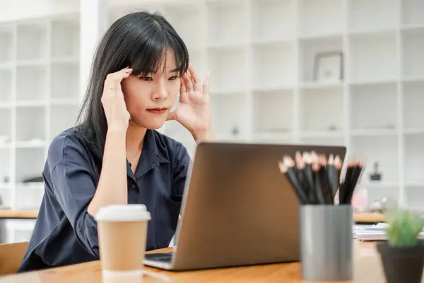 Young Professional Appears Stressed Tired She Works Her Laptop Trying Stock Picture