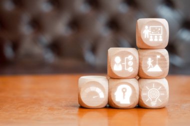 Wooden blocks with career icons symbolize growth, strategy, and success in professional development and business. clipart