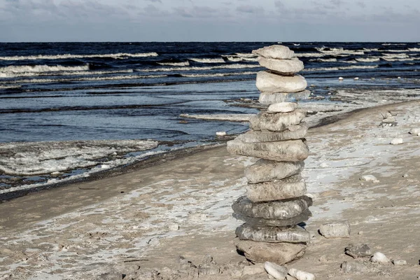 Ice pyramid on the coast of the Latvian sea