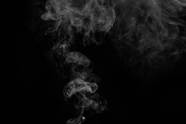White smoke on a black background, close up. smoke clubs of wh
