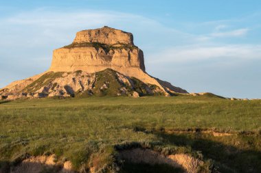 Early Morning at Scotts Bluff National Monument, Nebraska. Dome Rock rises 180 feet above the valley floor, which helped to guide the pioneers in their migration on the Oregon Trail.  clipart