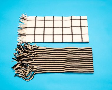 striped and checked scarves on a light blue background