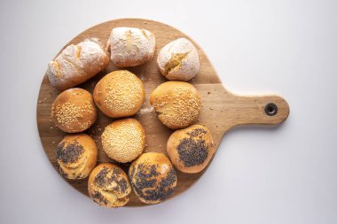 cutting board with fresh bread white background