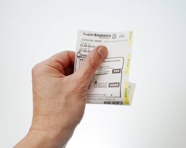 Superenalotto play sheet, Italy lottery. White background. Udine, Italy_February 20 2023