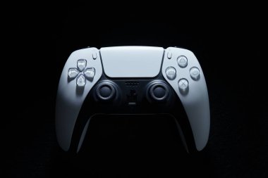 PlayStation controller from a dark background view. Udine, Italy_February 28 2023