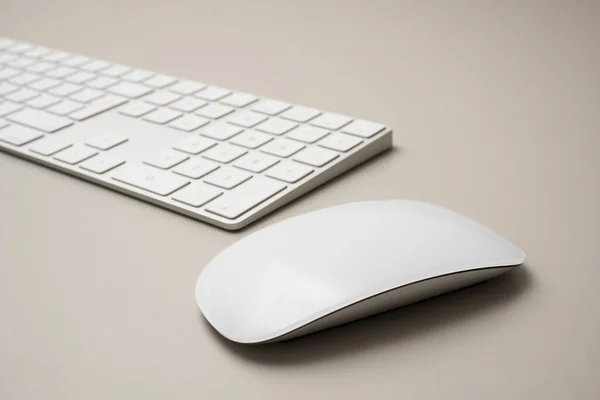 stock image Workplace with mouse in foreground and keyboard blurred in background