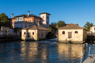 old mills on the Lemene river in Portogruaro, Veneto, Italy clipart