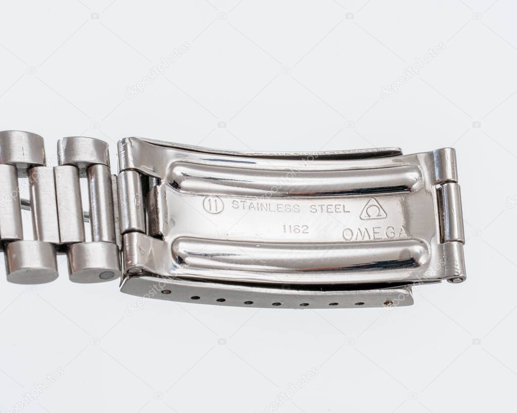 Close-up view of the Omega brand detail engraved on the metal strap buckle of the watch. Milan. Italy_ April 14_ 2025