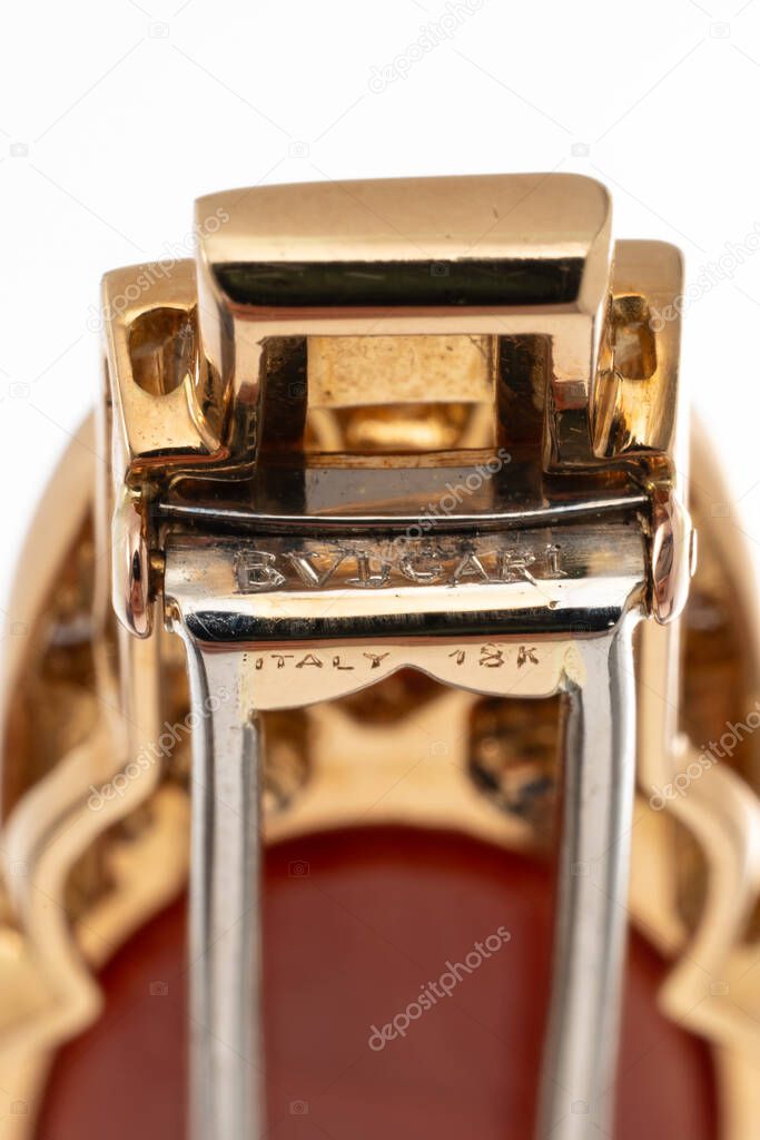 Detail of the Bulgari brand engraving on an 18kt gold brooch. Milan, Italy, July 8, 2025