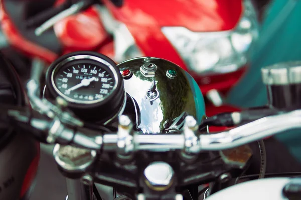 stock image close-up of a speedometer on a motorcycle and steering wheel isolated. High quality photo