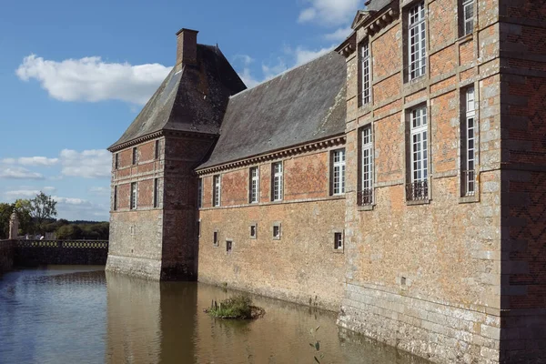 The ancient building of the chateau in France around the lake building, the building close-up has a place for the inscription. High quality photo