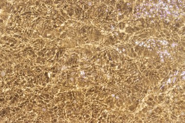 Kum ve su dokusunu yakından incele, yazıt için yer var. Yüksek kalite fotoğraf