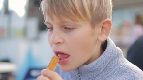 Teenage Boy European Appearance Enjoys Traditional Spanish Churros Outdoor Cafeteria — Stock Video