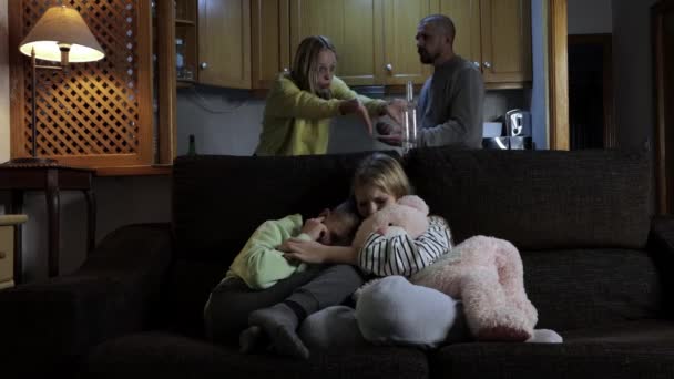 Frightened Little Children Sit Sofa Covering Ears Hear Parents Quarrels — Stock Video