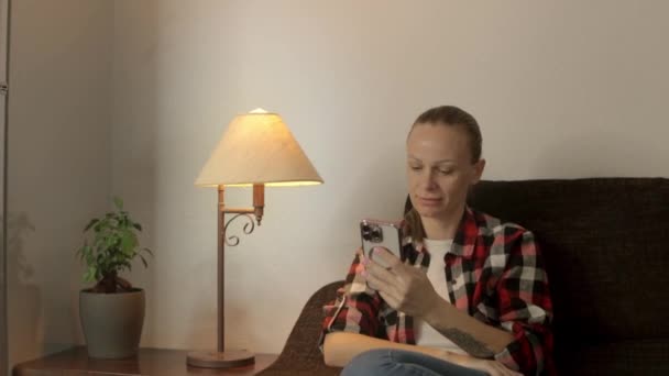 Portrait Beautiful Caucasian Girl Sitting Sofa Home Smartphone Her Hands — Stock Video