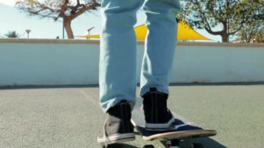 young man riding skateboard in the park