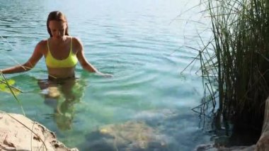 young woman in the water on the beach