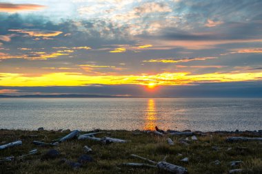 Sunrise with clouds on the coast of the Langanes peninsula in Ic clipart