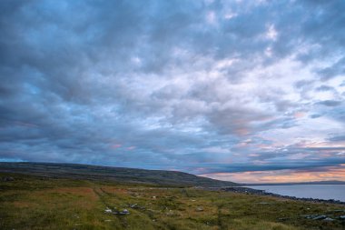 Sunrise with clouds on the coast of the Langanes peninsula in Ic clipart