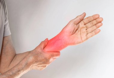 Wrist joint inflammation of Asian old woman. Concept of joint pain, arthritis and arm problems.