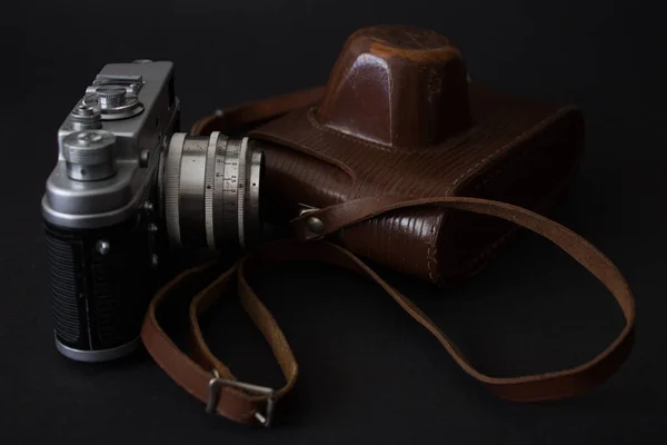 24.01.2023 Bialystok Poland.Retro photo camera and leather case.