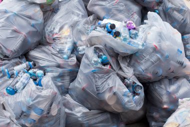 Stack of bags filled with recycling material, environmental protection