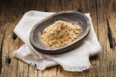 Castor oil grains in container, healthy oil