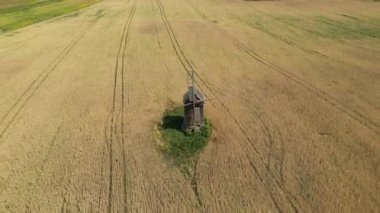 Aerial view of wind turbines, Scenic Aerial view of wind turbines farm in green field. Alternative energy, Wind farm generating green energy. Generating Clean Renewable Energy. Aerial view. 