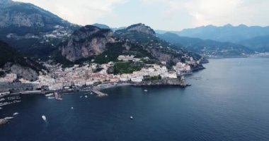 Positano, tourist destination on the Amalfi Coast, Historic White town along the Amalfi Coast Near Salerno. Aerial view of the famous tourist resort of the Amalfi coast. Blue Ocean with boats. 