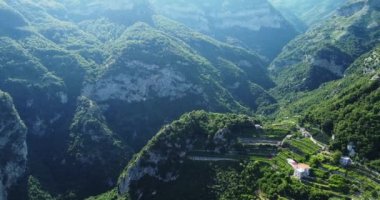 Aerial drone view of beautiful tropical valley between mountains. View from mountain. Aerial over the Blue Ridge Mountains at sunset sunshine Green pine tree forest on mountain range Nature background