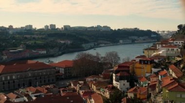 Aerial view of the old city with promenade of the Douro river. Amazing Porto in Portugal, Douro River, Old Town, Oporto. Coastal Northern City. Traditional bridge, famous travel destination 